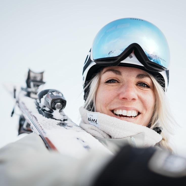 New Name, Lead Design Curator at Daily Habit Tracker, reviewing corporate floral arrangements